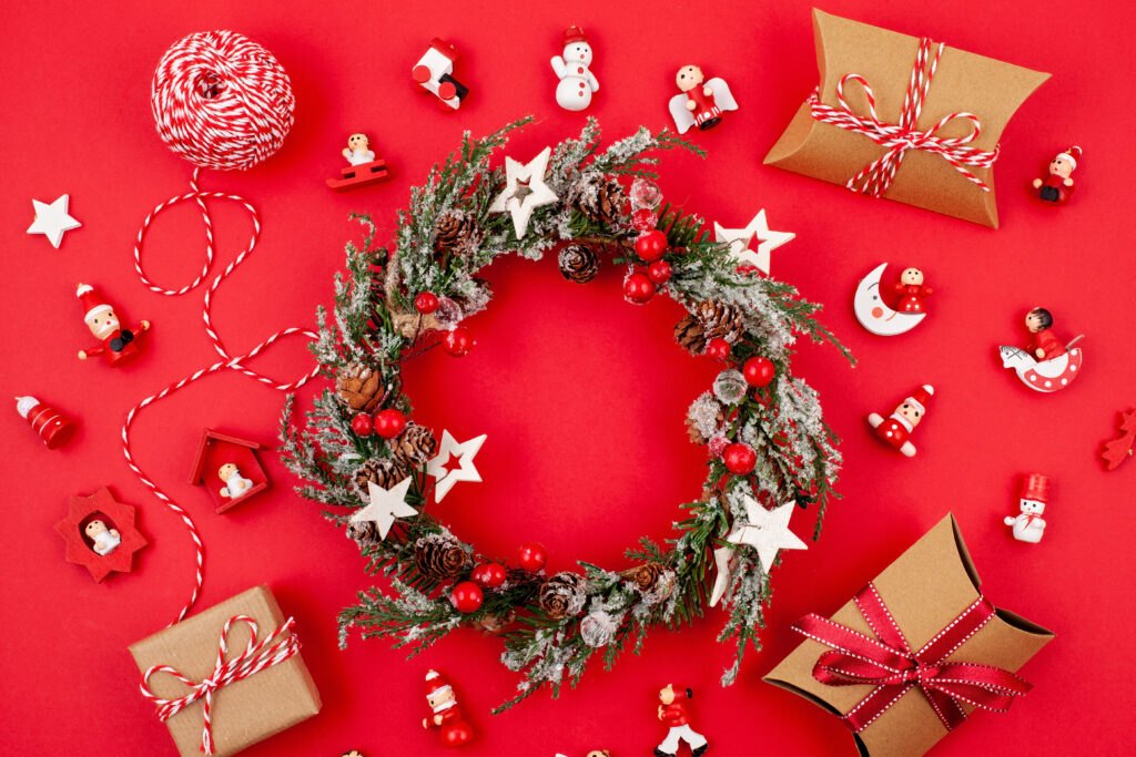 Wholesale Christmas wreath decorations with stars and pinecones on a red background
